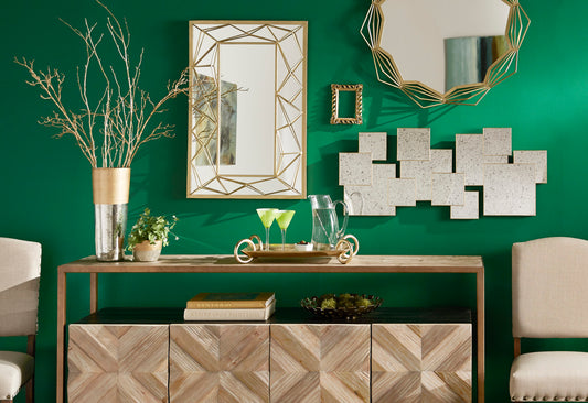 This picture shows what this post is all about: mirror decorating ideas. Three different mirrors hang over a server for an eye-catching look.